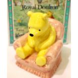 Royal Doulton figurine, Winnie in chair, H: 8 cm. P&P Group 1 (£14+VAT for the first lot and £1+