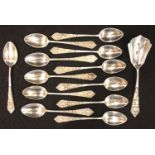 A set of twelve continental 800 silver teaspoons with sugar spoon, each relief decorated and