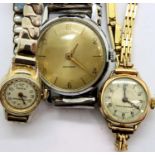 A gents Timex wristwatch and two vintage ladies wristwatches. P&P Group 1 (£14+VAT for the first lot