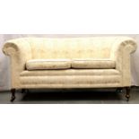 A contemporary fabric upholstered chesterfield style sofa, 165 x 76 x 80 cm H. Not available for