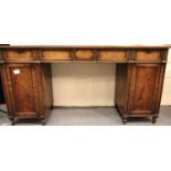 A Regency mahogany twin-pedestal buffet, drawers moulded, with cupboard and lined cellarette drawer,