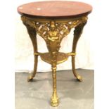 A cast iron circular table, later gold painted with a polished mahogany top. D: 61 cm. H: 75 cm. Not