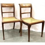 A pair of Regency period walnut framed chairs, each with bar-back and Bergere seat. Not available