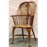 A 19th Century elm Windsor chair, stickback and pierced back rest, turned elbow supports and