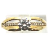 9ct gold solitaire ring with stone set shoulders, size P. P&P Group 1 (£14+VAT for the first lot and