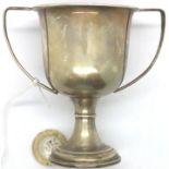 Hallmarked silver twin handled trophy 57g on stand. P&P Group 1 (£14+VAT for the first lot and £1+