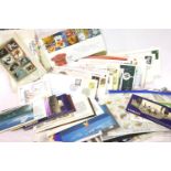 Box of mixed new and used stamps and postcards. P&P Group 2 (£18+VAT for the first lot and £3+VAT