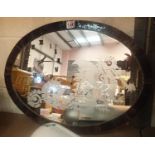 Oval mirror with dragon etching and clock, 57 x 42 cm. Not available for in-house P&P, contact