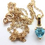 9ct gold blue topaz set pendant on a damaged fine 9ct gold chain, 1.1g. P&P Group 1 (£14+VAT for the