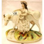 Staffordshire milkmaid with cow figurine, girls head reglued and cows horns chipped. P&P Group 2 (£