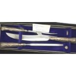 Boxed hallmarked silver handled three piece carving set. P&P Group 2 (£18+VAT for the first lot