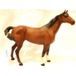 Beswick swish tail horse, matte finish, H: 21 cm. P&P Group 2 (£18+VAT for the first lot and £3+