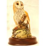 Royal Doulton barn owl on wooden plinth, H: 20 cm. P&P Group 2 (£18+VAT for the first lot and £3+VAT