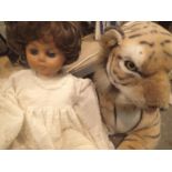 Large stuffed Tiger and a battery operated singing doll. Not available for in-house P&P, contact