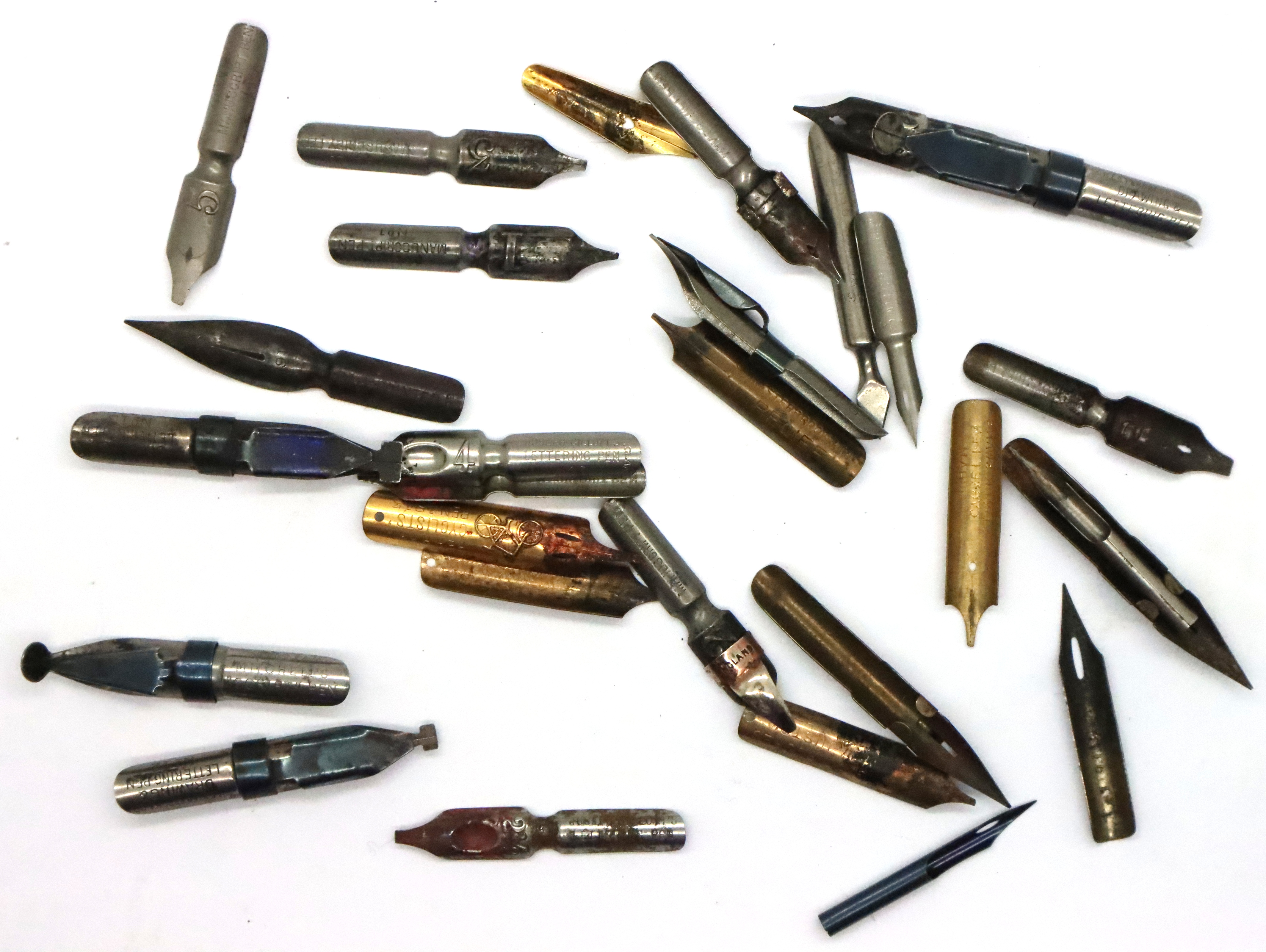 Mixed named pen nibs including a cyclist example. P&P Group 1 (£14+VAT for the first lot and £1+