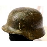 German WWII Luftwaffe M40 helmet with remnants of snow camouflage paint. P&P Group 2 (£18+VAT for