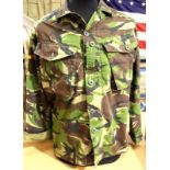 Fifty jungle camouflage DPM Grade 1 shirts. P&P Group 3 (£25+VAT for the first lot and £5+VAT for