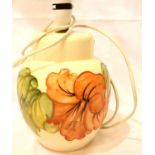 Moorcroft Hibiscus lamp on cream ground, H: 28 cm. P&P Group 3 (£25+VAT for the first lot and £5+VAT