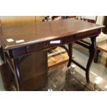 Good quality single drawer and sliding rest mahogany table and a glass TV stand. Not available for