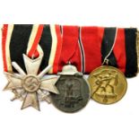 Third Reich medal group, comprising West Merit Cross, Eastern Front & Sudetenland Awards. P&P