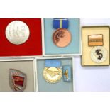 Five East German medals, boxed. P&P Group 1 (£14+VAT for the first lot and £1+VAT for subsequent