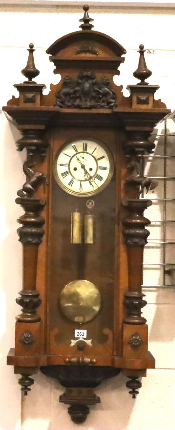 A 19th Century Bavarian walnut cased Vienna wall clock, the enamelled dial with subsidiary