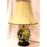 Substantial Moorcroft baluster form lamp base in the Lillies pattern, with its original supplied