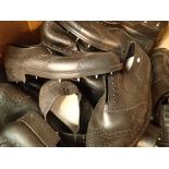 Box of approximately thirty pairs of black brogue style golf shoes, size eight. Not available for