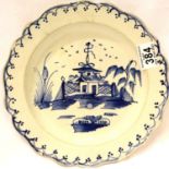 18th century Chinese glazed plate, decorated with pagoda within a garden in blue over a white