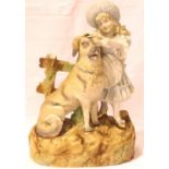 Large Continental bisque figurine of a young girl with a dog, H: 38 cm. Not available for in-house