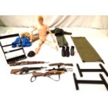 Action Man, flock hair c1964, cracks on arms and legs, also includes five rifles with rack,