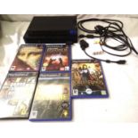 Sony Playstation 2 console with leads and five games. P&P Group 2 (£18+VAT for the first lot and £