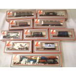 Ten boxed Lima OO scale wagons includes British Leyland car transporter with six cars, mostly in