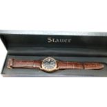 Stauer; gents wristwatch with black dial, brown leather strap and gold plated case with box and