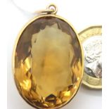 9ct bound large citrine pendant. Pendant 33mm. 14g, some light surface marks but no visible chips.