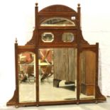 Walnut overmantle with bevelled edge mirrors and carved decoration, 88 x 103 cm H. Not available for