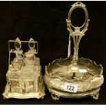 A silver plated condiment stand with four bottles and a silver plated condiment, lacking bottles.