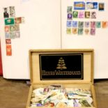 Stamp album containing world wide stamps and a box of loose stamps. Not available for in-house P&