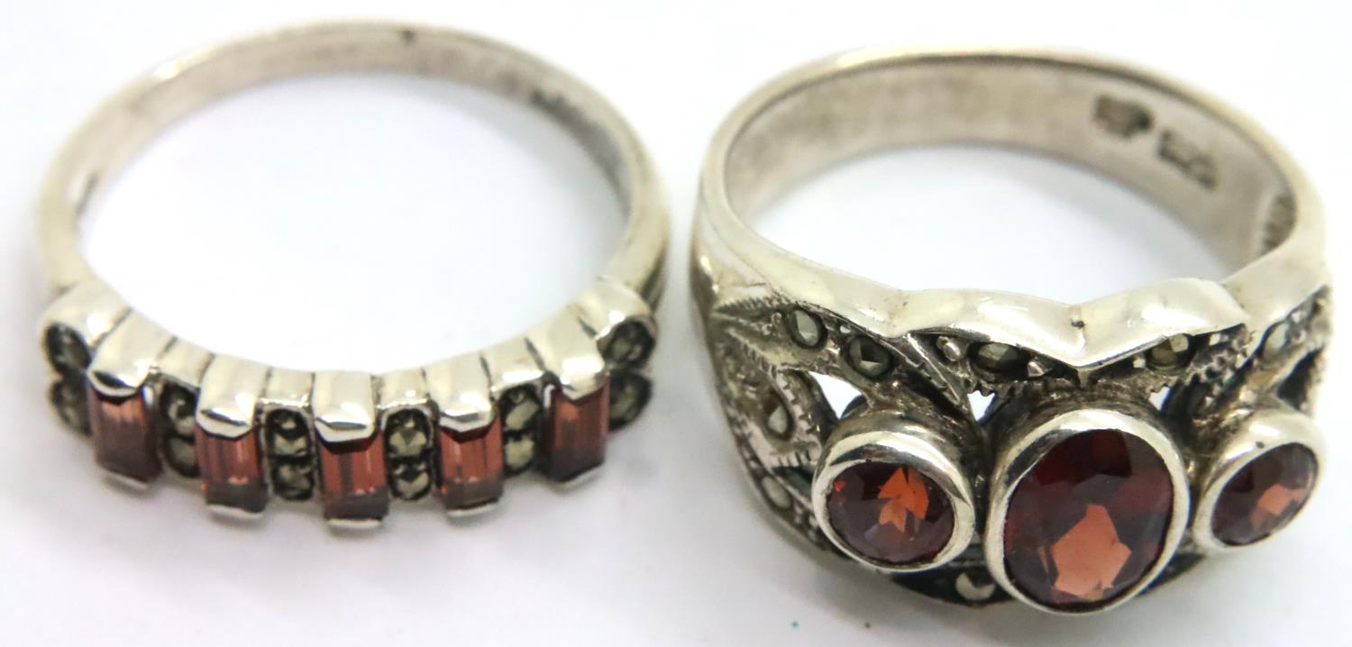 Two 925 silver rings set with red stones. P&P Group 1 (£14+VAT for the first lot and £1+VAT for