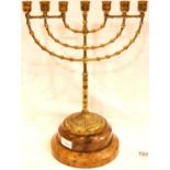Brass Menorah on a machine turned olivewood base, H: 41 cm. P&P Group 3 (£25+VAT for the first lot