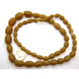 Butterscotch amber bead necklace, L: 72 cm, largest bead: 31 mm. P&P Group 1 (£14+VAT for the