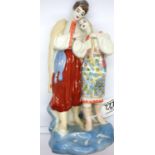 Eastern European couple figurine, H: 27 cm. P&P Group 2 (£18+VAT for the first lot and £3+VAT for