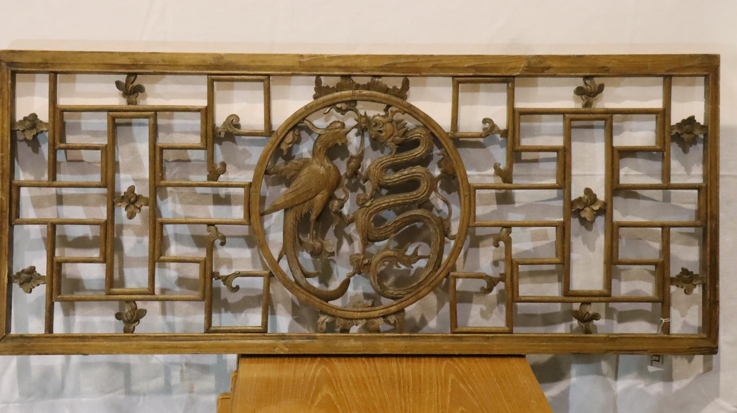 19th Century Chinese fretwork wooden panel with dragon and phoenix central motif, 49 x 112 cm. Not