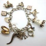 Hallmarked silver charm bracelet with twelve charms, L: 24 cm, 53g, charms not hallmarked, clasp and