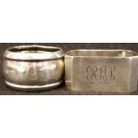 Two hallmarked silver napkin rings, one dated 1930 by inscription, combined 42g. P&P Group 1 (£14+