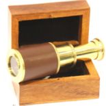 Boxed brass and leather telescope. P&P Group 2 (£18+VAT for the first lot and £3+VAT for