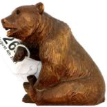 Black Forest carved wooden bear, H: 12 cm. P&P Group 1 (£14+VAT for the first lot and £1+VAT for