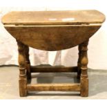 19th century country oak drop-leaf table of small proportions, jointed construction with turned