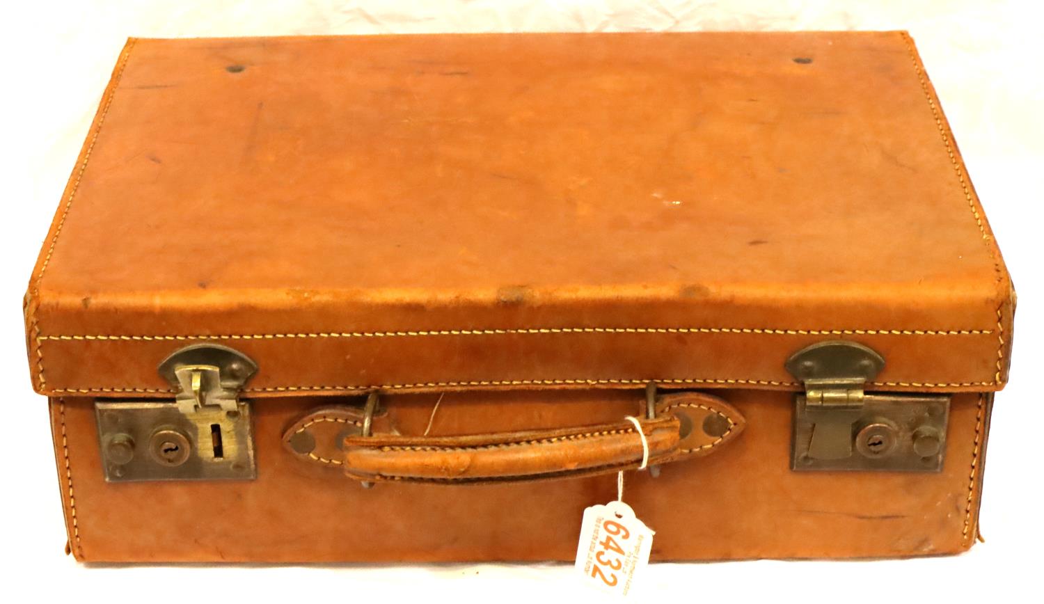 Small leather suit case, 41 x 13 x 29 cm H. P&P Group 2 (£18+VAT for the first lot and £3+VAT for