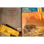 Two Haynes car repair manuals, Sierra and Cortina, a vintage Austin A40 manual and a motorcycle
